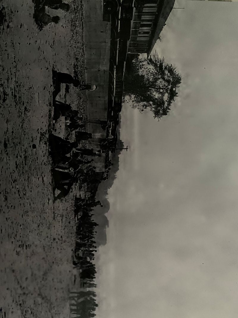 Black and white photo of people on the beach